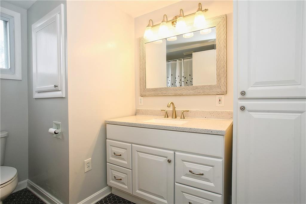 46 Michael Road Russellton, PA 15076 - Photo 17 of 25 a bathroom with a granite countertop sink vanity mirror and toilet