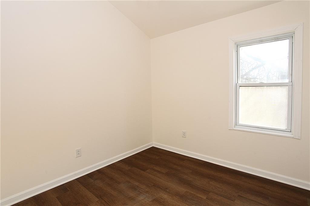 46 Michael Road Russellton, PA 15076 - Photo 21 of 25 an empty room with wooden floor and windows