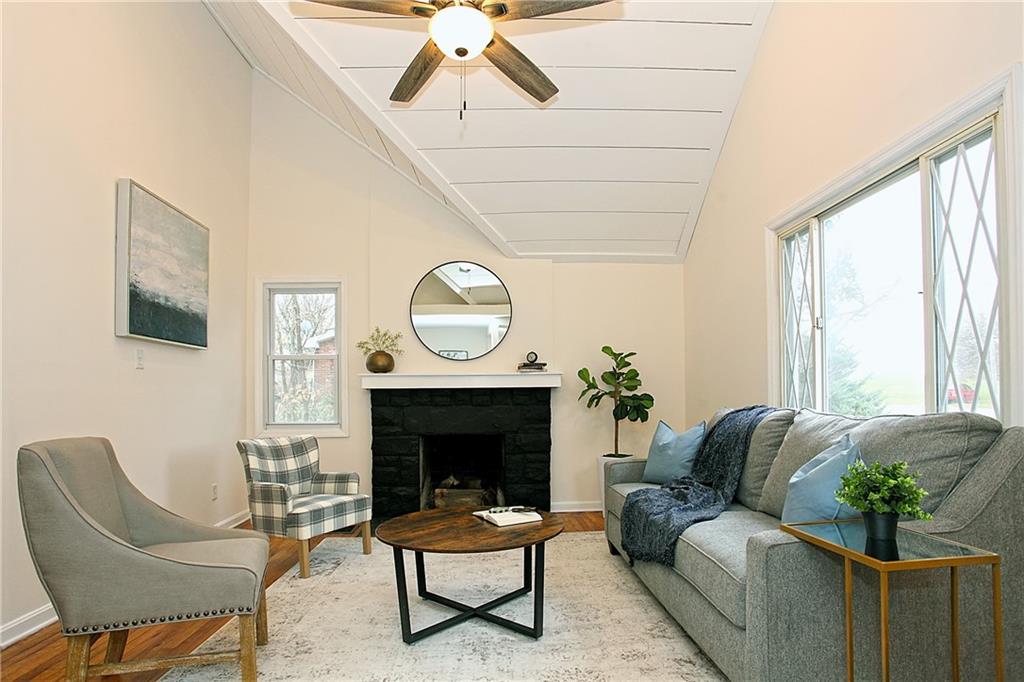 46 Michael Road Russellton, PA 15076 - Photo 6 of 25 a living room with furniture a large window and a fireplace