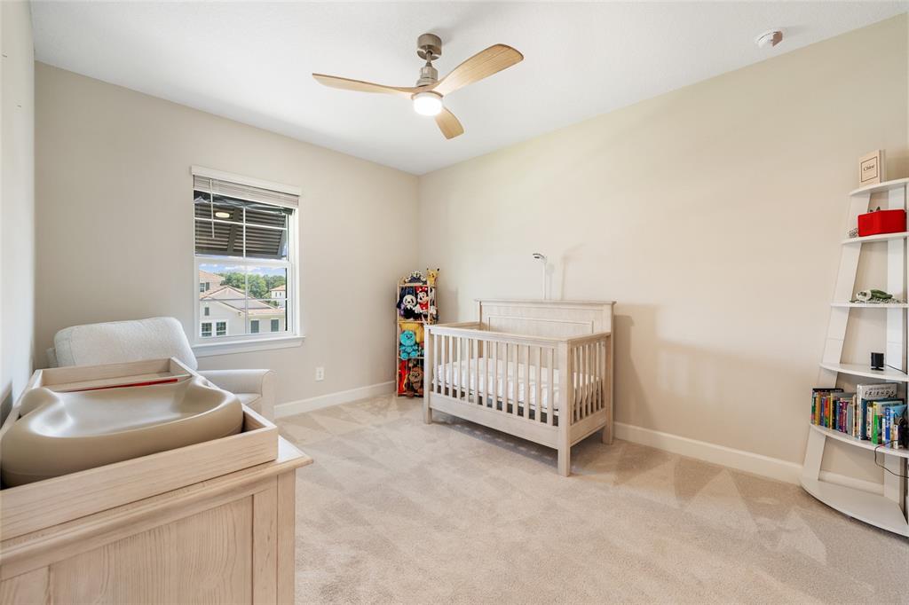 10175 Brocksport Circle Gotha, FL 34734 - Photo 47 of 54 a bedroom with furniture and a window
