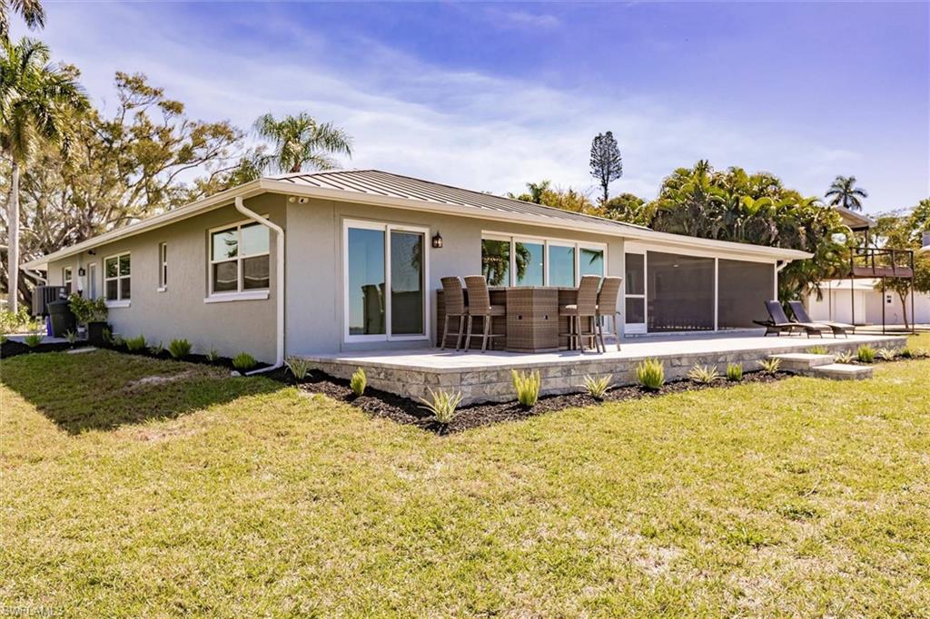 138 Riverview Road Fort Myers, FL 33905 - Photo 40 of 50 a front view of a house with swimming pool and porch