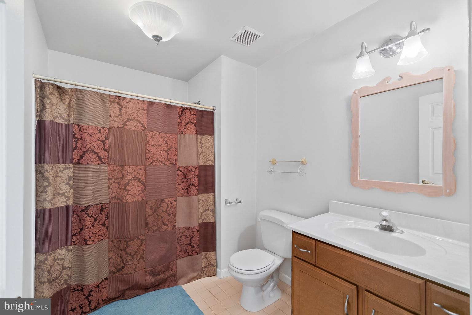 1326 Bernoudy Road White Hall, MD 21161 - Photo 15 of 32 a bathroom with a sink toilet and shower
