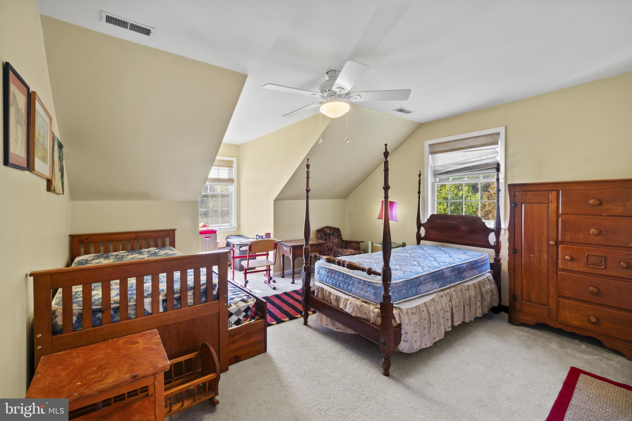 1326 Bernoudy Road White Hall, MD 21161 - Photo 18 of 32 a bedroom with a bed and a chandelier