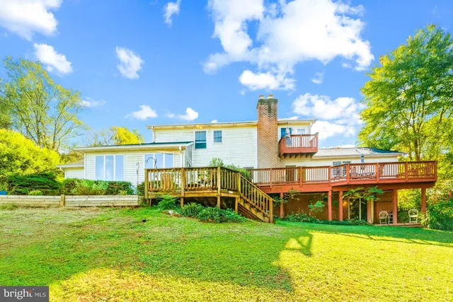 a view of backyard with a deck