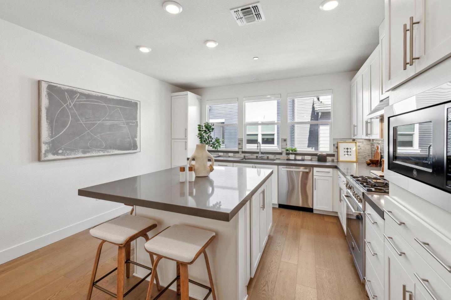 2266 Mora Place Mountain View, CA 94040 - Photo 2 of 32 a kitchen with counter top space appliances and windows