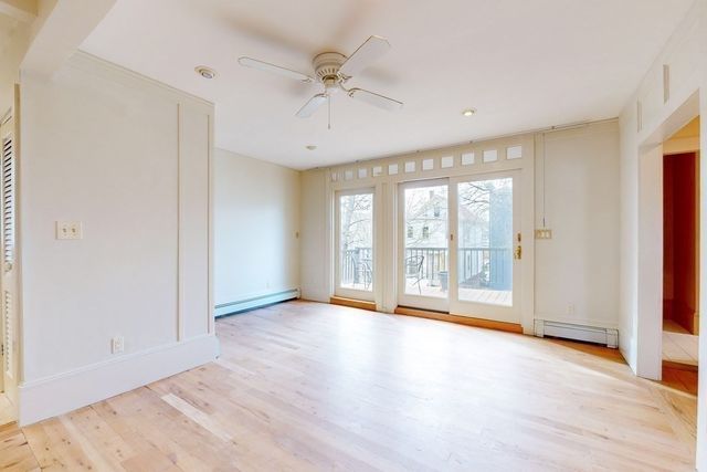 a view of an empty room with a window