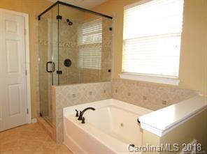 149 Snead Road, Unit 70 Fort Mill, SC 29715 - Photo 11 of 15 a bathroom with a shower and a bathtub