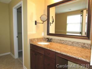 149 Snead Road, Unit 70 Fort Mill, SC 29715 - Photo 12 of 15 a bathroom with a granite countertop sink and a mirror