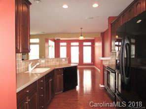149 Snead Road, Unit 70 Fort Mill, SC 29715 - Photo 5 of 15 a kitchen with stainless steel appliances granite countertop a sink a stove and a refrigerator