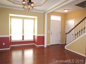 149 Snead Road, Unit 70 Fort Mill, SC 29715 - Photo 6 of 15 a view of an empty room with wooden floor and a window