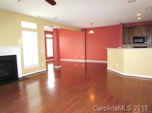 149 Snead Road, Unit 70 Fort Mill, SC 29715 - Photo 8 of 15 a view of a kitchen with kitchen island and a window