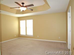 149 Snead Road, Unit 70 Fort Mill, SC 29715 - Photo 10 of 15 an empty room with a window and a fan