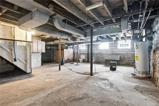 a view of empty room with wooden walls