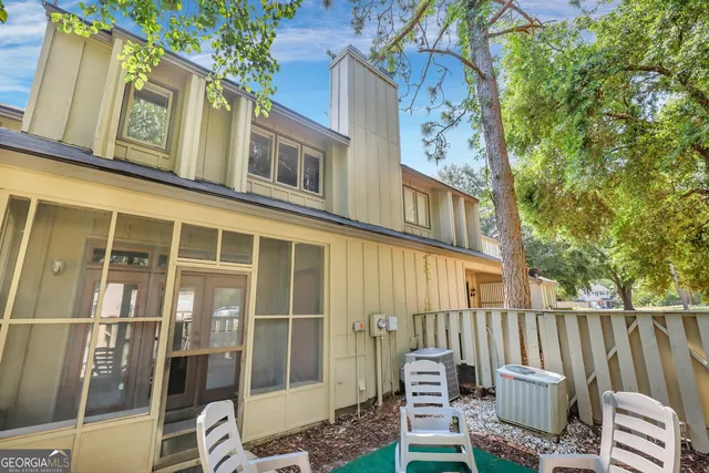 a view of a chair and table in the balcony