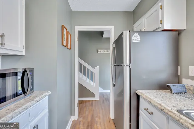 a kitchen with a refrigerator and countertop