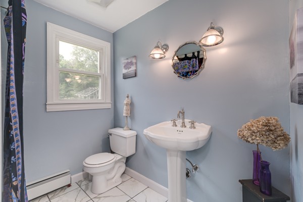 11 Glenmere Road Charlton, MA 01507 - Photo 11 of 30 a bathroom with a sink a toilet and mirror