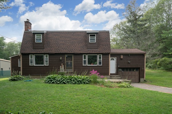 11 Glenmere Road Charlton, MA 01507 - Photo 2 of 30 a front view of a house with a garden and yard