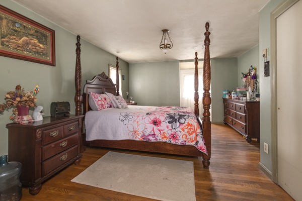 11 Glenmere Road Charlton, MA 01507 - Photo 22 of 30 a bedroom with a bed and wooden floor