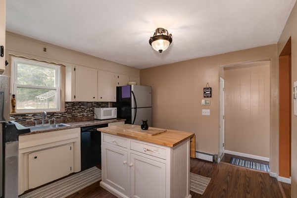 11 Glenmere Road Charlton, MA 01507 - Photo 4 of 30 a kitchen that has a sink and a stove in it