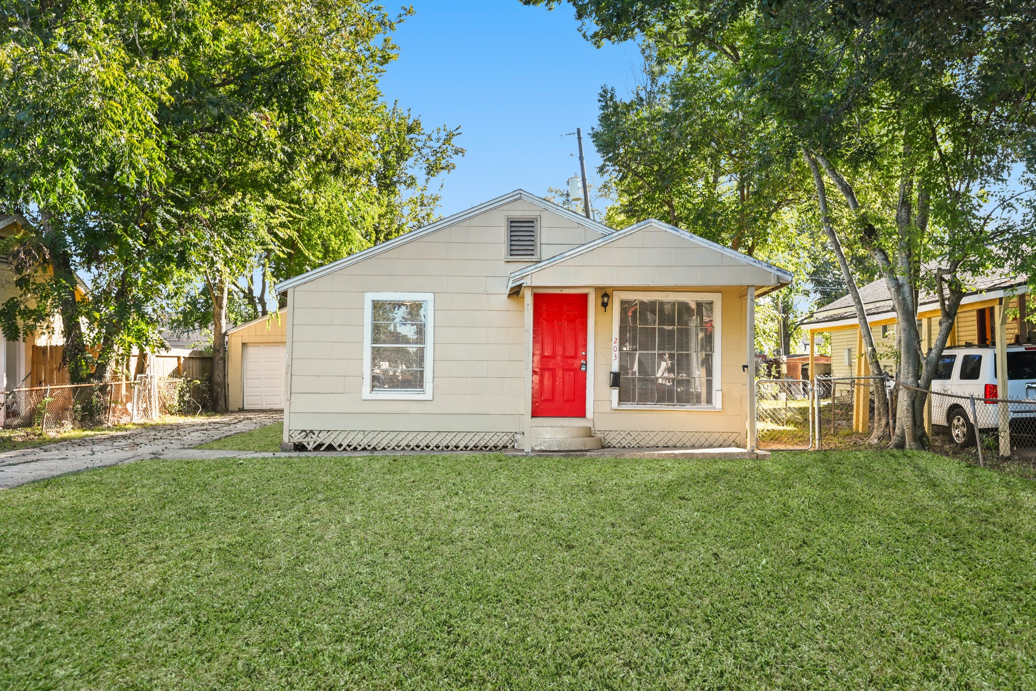 a front view of house with yard and green space