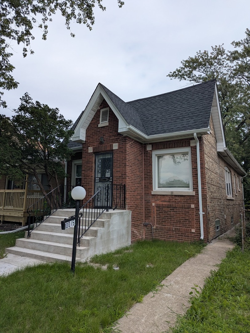 a front view of house with a garden
