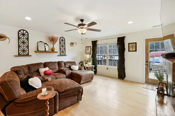 a living room with furniture and a fireplace