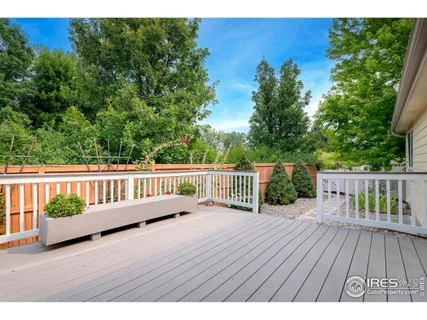 a view of deck with a large trees