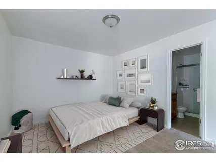 a bedroom with a bed and a walk in closet