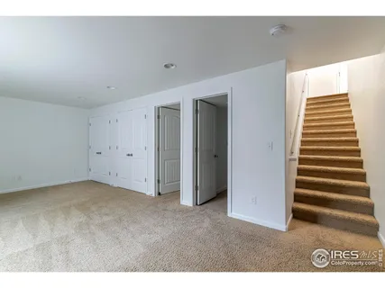 a view of an empty room with a fireplace