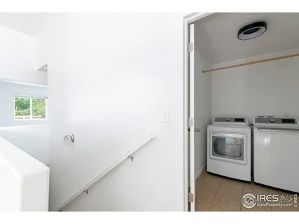 a kitchen with a refrigerator and a stove