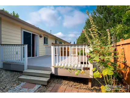 a view of balcony with wooden floor and seating space