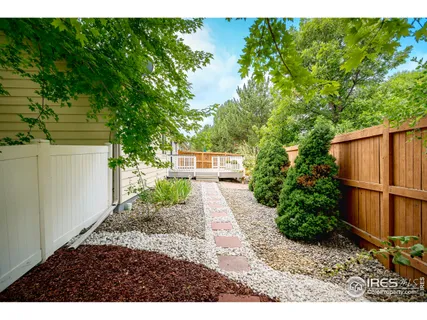 a view of backyard with outdoor space and trees