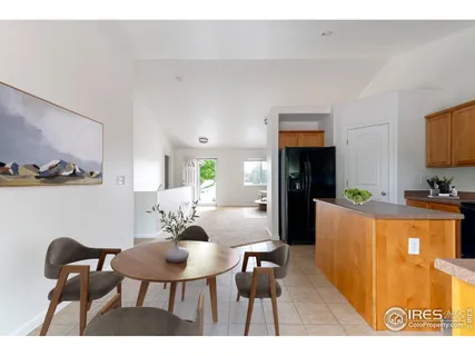 a view of kitchen and dining room with furniture