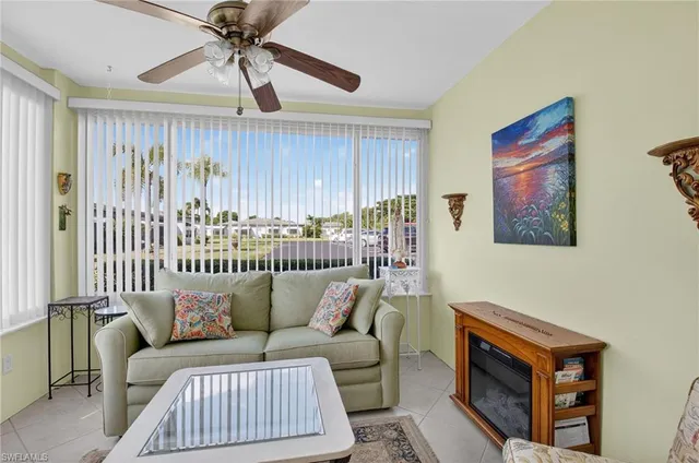 a kitchen with stainless steel appliances granite countertop a dining table chairs and granite counter tops