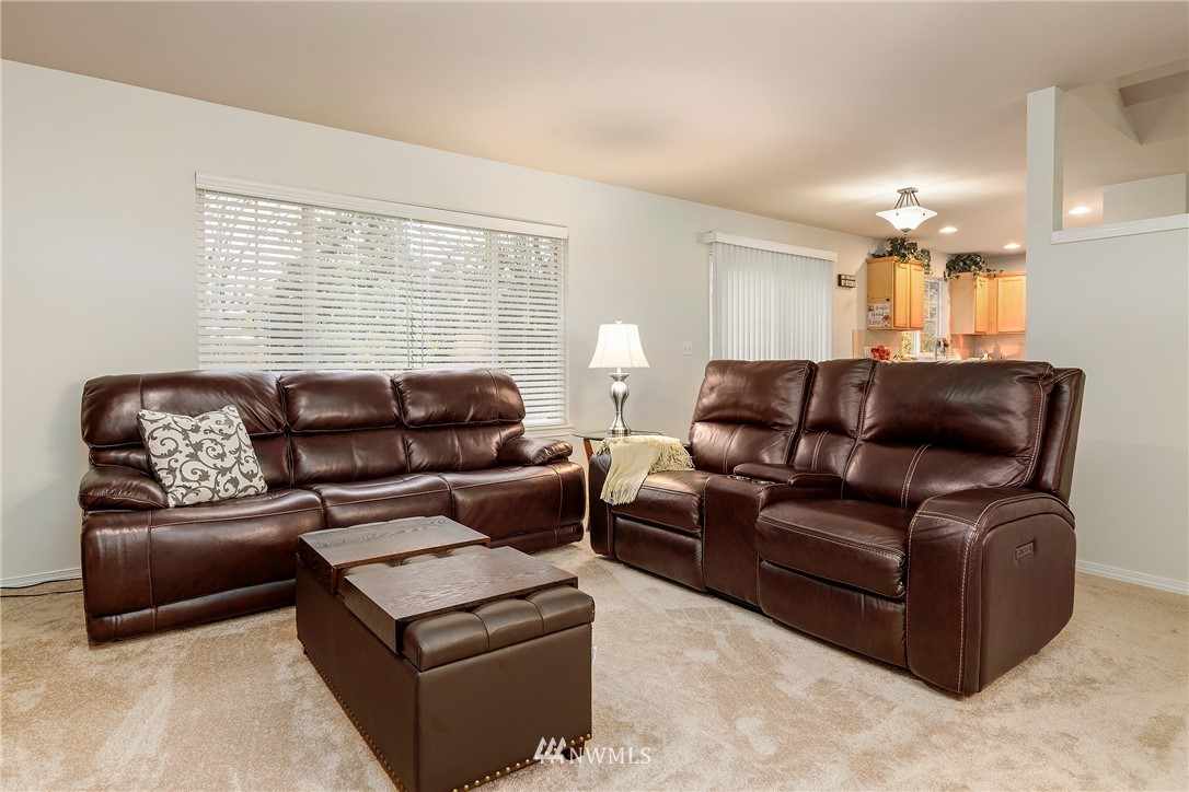 3136 Northeast 20th Place Renton, WA 98056 - Photo 13 of 29 a living room with furniture and a large window