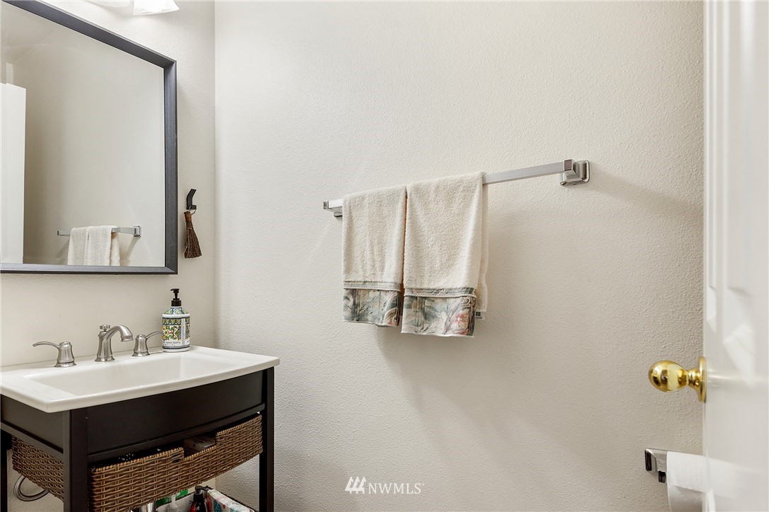 3136 Northeast 20th Place Renton, WA 98056 - Photo 14 of 29 a bathroom with a sink and mirror with toilet