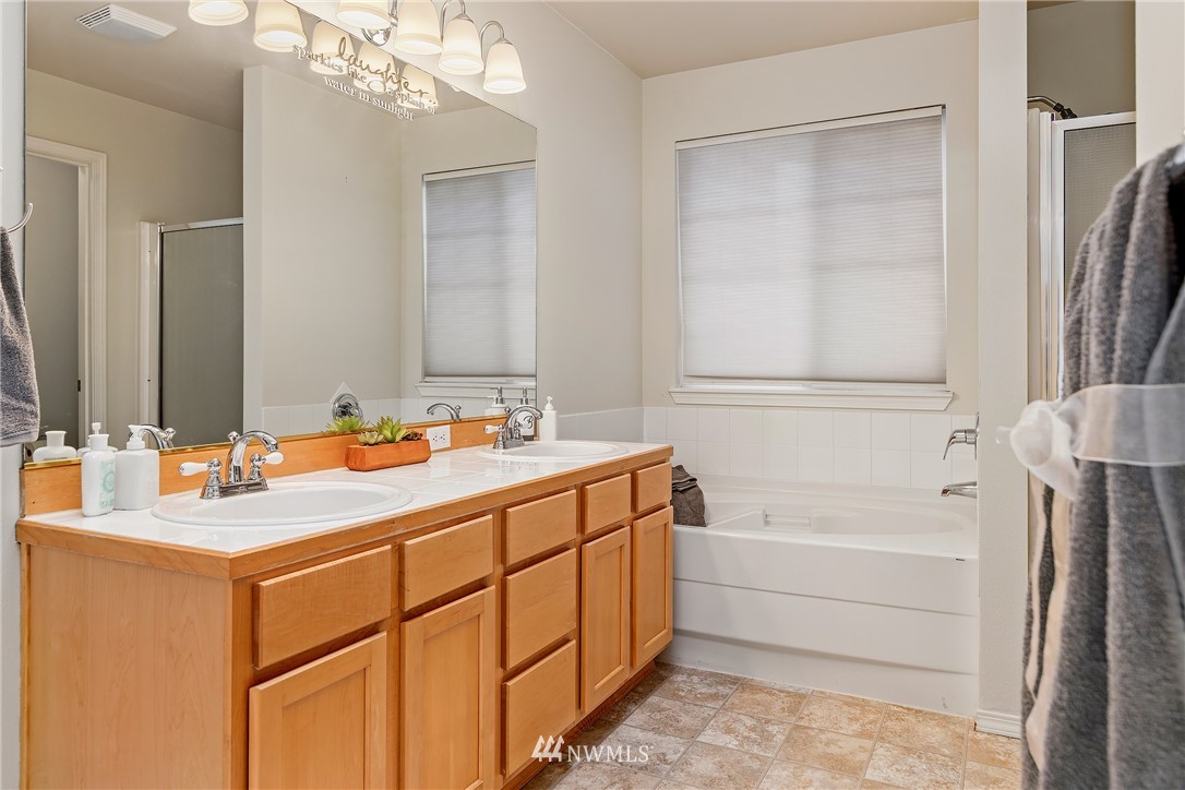 3136 Northeast 20th Place Renton, WA 98056 - Photo 19 of 29 a bathroom with a tub sink and mirror