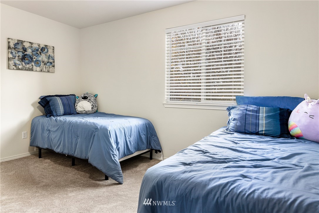 3136 Northeast 20th Place Renton, WA 98056 - Photo 21 of 29 a bedroom with bed and a window
