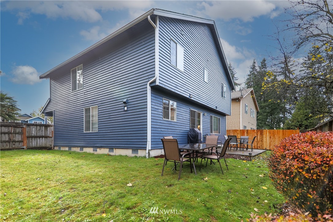 3136 Northeast 20th Place Renton, WA 98056 - Photo 29 of 29 a backyard of a house with table and chairs