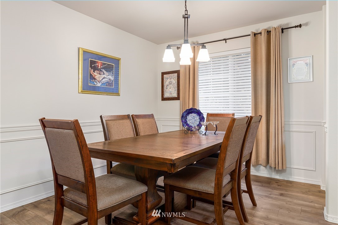3136 Northeast 20th Place Renton, WA 98056 - Photo 6 of 29 a view of a dining room with furniture window and wooden floor