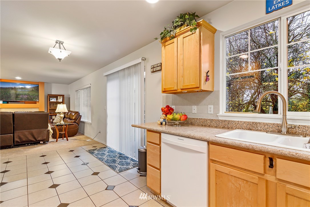 3136 Northeast 20th Place Renton, WA 98056 - Photo 9 of 29 a kitchen with a sink cabinets and window