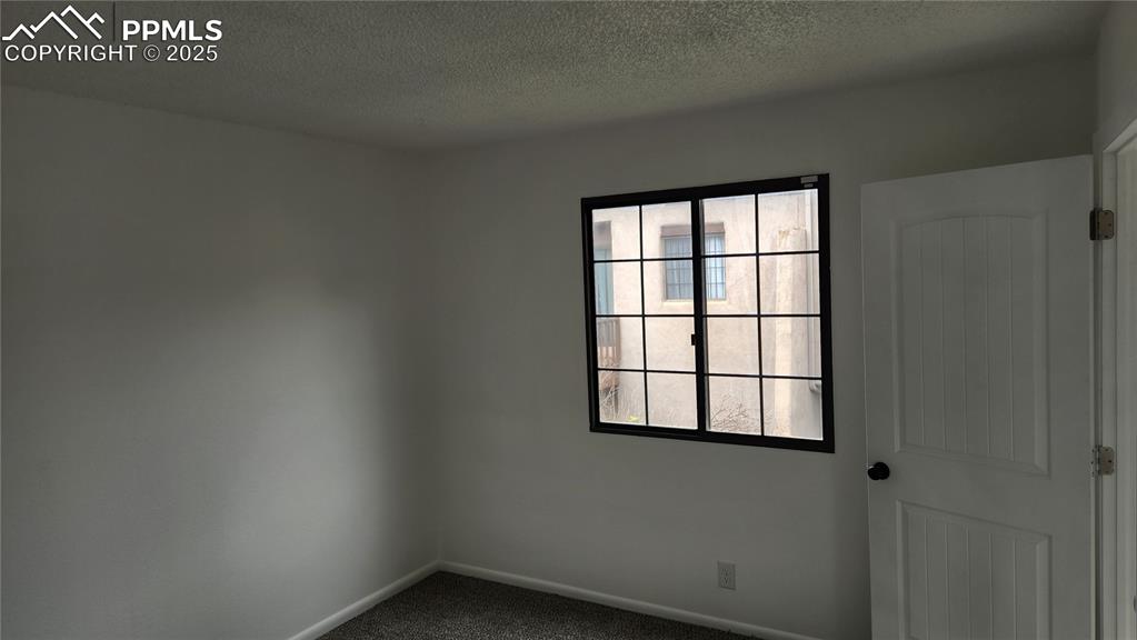 2007 Mohawk Road Pueblo, CO 81001 - Photo 14 of 19 an empty room with windows