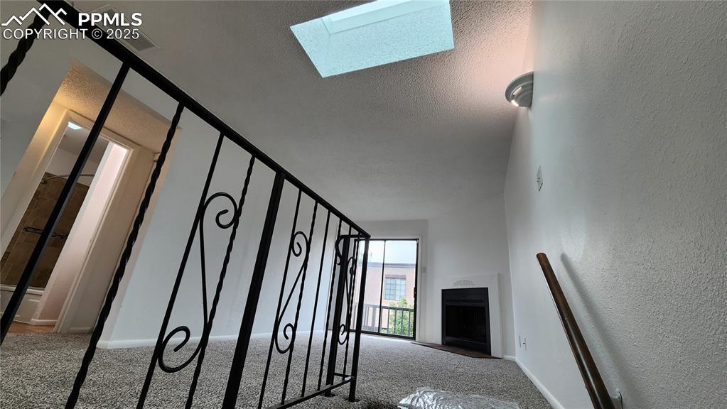 2007 Mohawk Road Pueblo, CO 81001 - Photo 5 of 19 a view of staircase with railing and a window