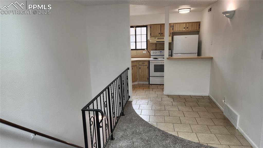 2007 Mohawk Road Pueblo, CO 81001 - Photo 7 of 19 a view of a kitchen with furniture and empty room
