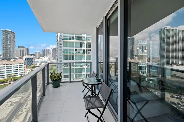 a view of a balcony with chairs