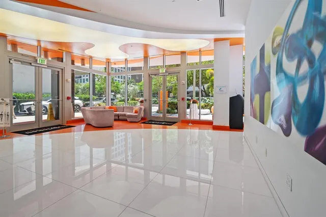 a city view from a balcony with outdoor seating