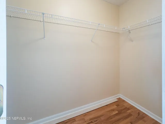 a view of a room with racks on the wall