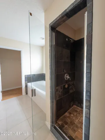 a bathroom with glass door