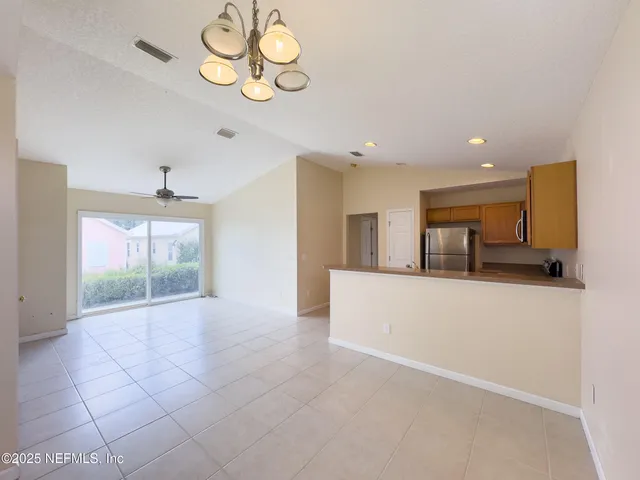 a view of kitchen with furniture and window