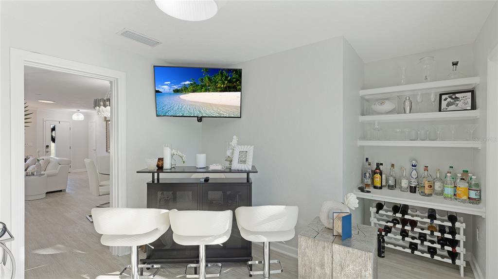 6726 South Lockwood Ridge Road Sarasota, FL 34231 - Photo 27 of 36 a view of a dining room with furniture and wooden floor